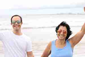 Photo down syndrome with his mother enjoying on the beach