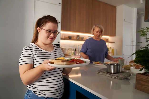 Down syndrome woman serving breakfast