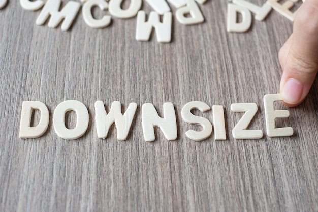 DOWNSIZE word of wooden alphabet letters. Business and Idea concept