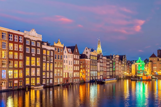 Downtown Amsterdam city skyline. Cityscape  in Netherlands at sunset