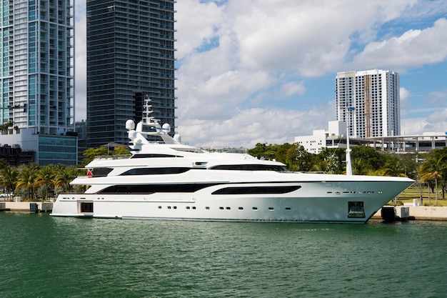 Downtown Miami along Biscayne Bay with condos and office buildings yacht docked in the bay