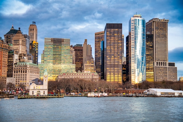 Downtown New York City at sunset from a moving ferry boat.