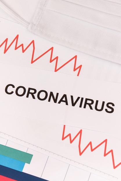 写真 コロナウイルスによる金融危機を表す下向きのグラフ covid-19 sars-cov-2 2019ncov