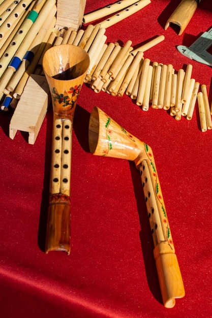 Dozens of handmade bamboo flutes in display