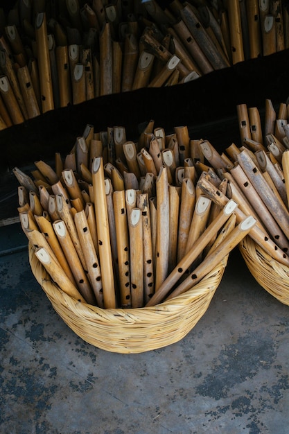 Dozens of handmade wooden flutes in display