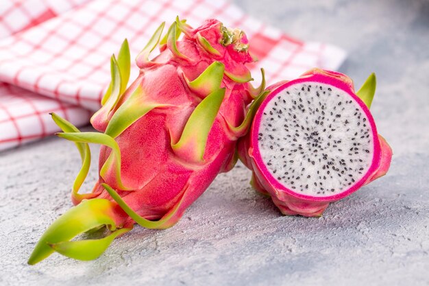 Dragon fruit isolated on wooden background, fresh pitaya