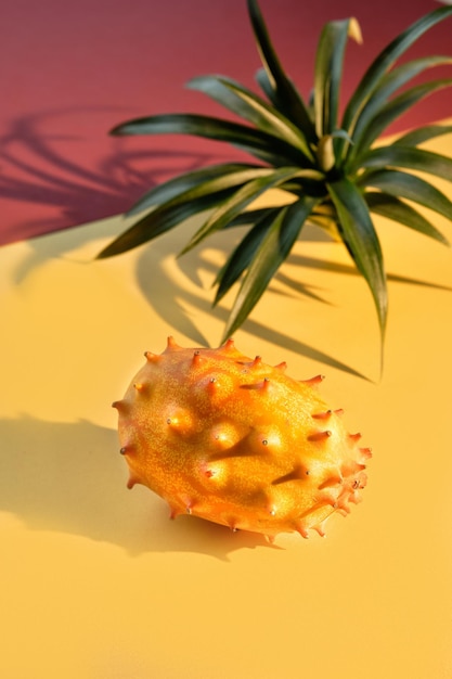 Dragon fruit pitahaya closeup on two color paper background Vibrant golden yellow and dull red