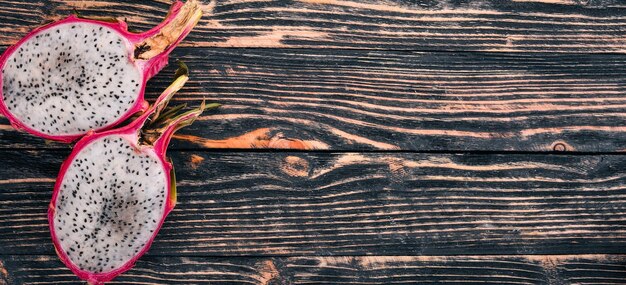 Dragon Fruit Tropical Fruits On a wooden background Top view Copy space