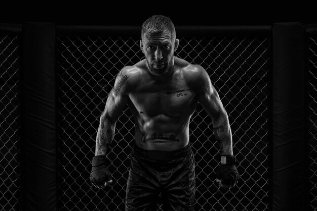 The dramatic black white image of the MMA fighter Photography in a real octagon Brutal fighter Mixed media