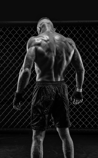 Photo the dramatic black white image of the mma fighter photography in a real octagon brutal fighter mixed media