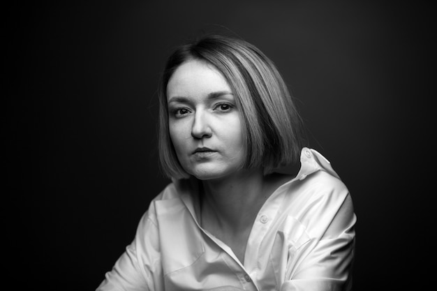 Dramatic black and white portrait of a woman