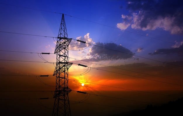 Dramatic clouds sky and electric tower