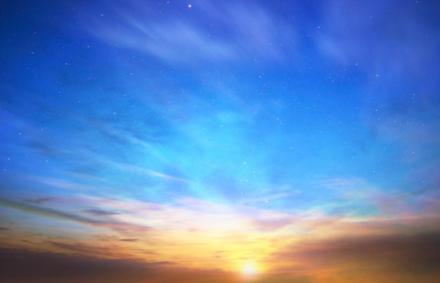 dramatic cloudy blue orange pink sky at sunset sea with seashell on beach stone promenade