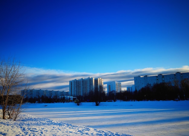 Dramatic light leak on winter river city landscape