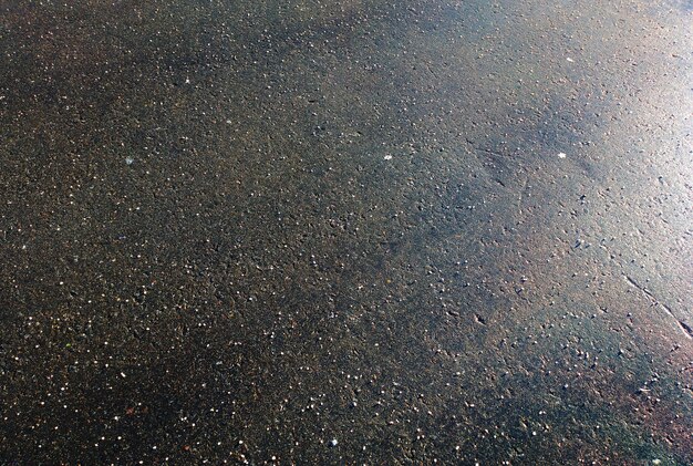 Dramatic light on street asphalt background