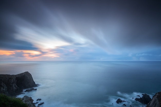 Dramatic seascape of blurred sky and waves Costa Vicentina Sagres