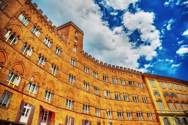 Dramatic sky over Sansedoni Palace in Siena Italy