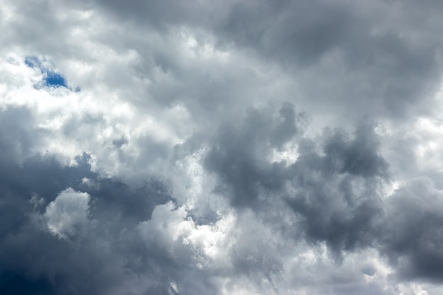 Dramatic sky with gray white blue clouds. Overcast and cloudy to rain