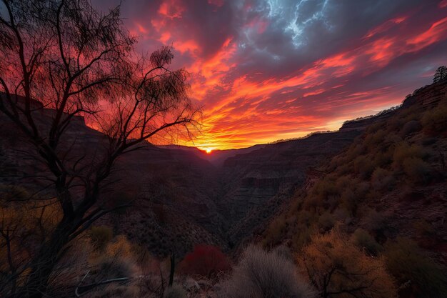 Dramatic sunset over canyon with fiery sky and silhouetted trees created with generative ai