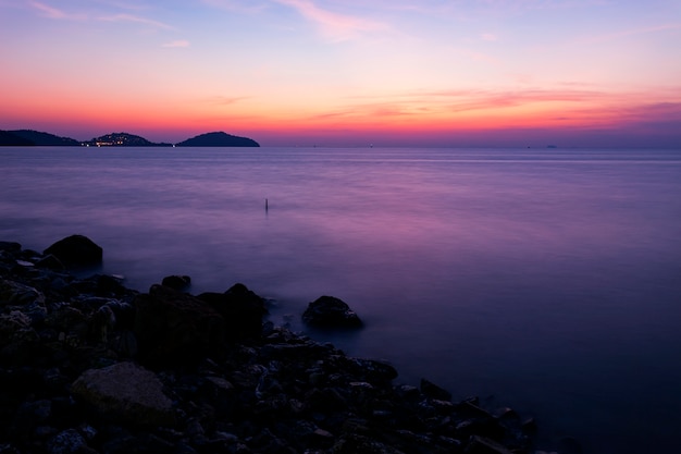 dramatic sunset or sunrise,beautiful colorful light in the sky clouds over tropical sea