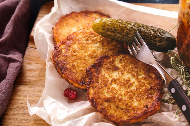 Draniki with salt cucumber Potato pancakes National food