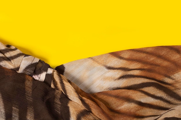 Drawing on the fabric of a tiger skin on a yellow background