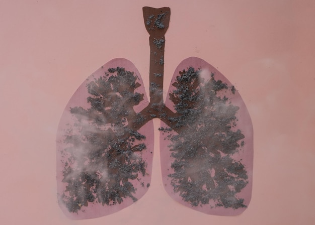 Drawing of human lungs covered in ash from cigarette or cigar smoke. Copy space