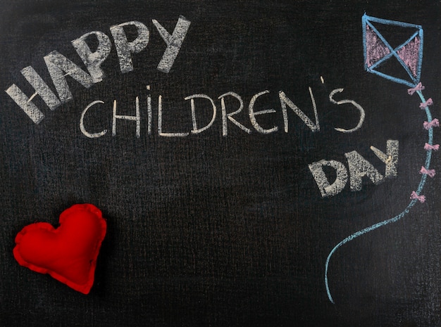 Drawing on sandpaper. Happy Children's day and heart.