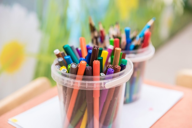 Drawing tools color pencils in glass beaker