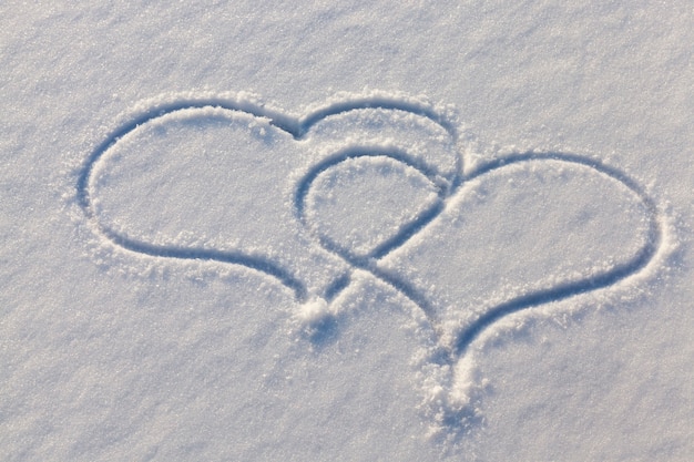 Drawn in the winter season, the heart on the snow