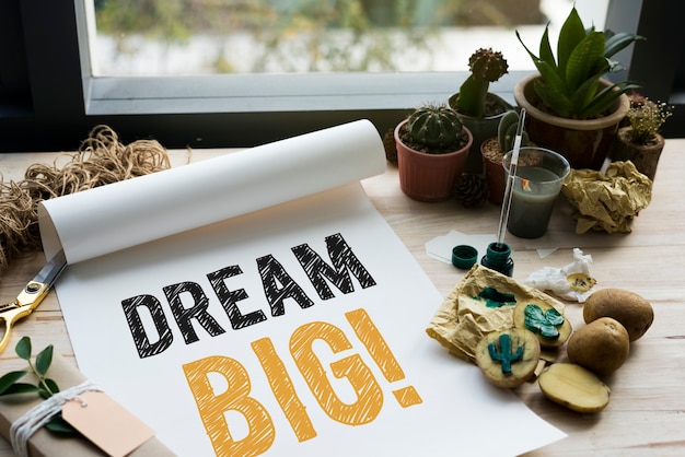 Photo dream big written on a white paper and cactus