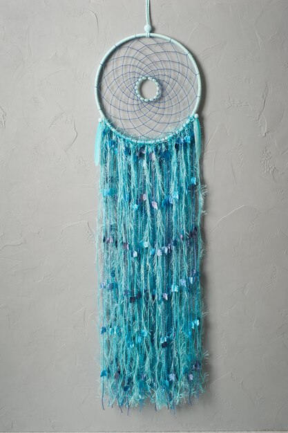 Dream catcher with blue threads