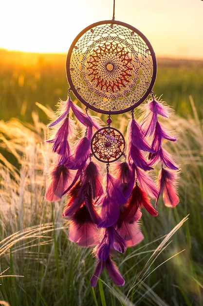 Dream catcher with feathers threads and beads rope hanging.\
dreamcatcher handmade