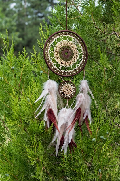 Dream catcher with feathers threads and beads rope hanging. Dreamcatcher handmade