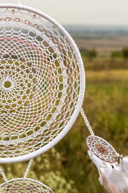 Dream catcher with feathers threads and beads rope hanging\
dreamcatcher handmade