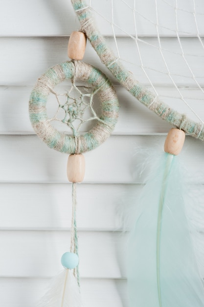 Dream catcher with mint feathers