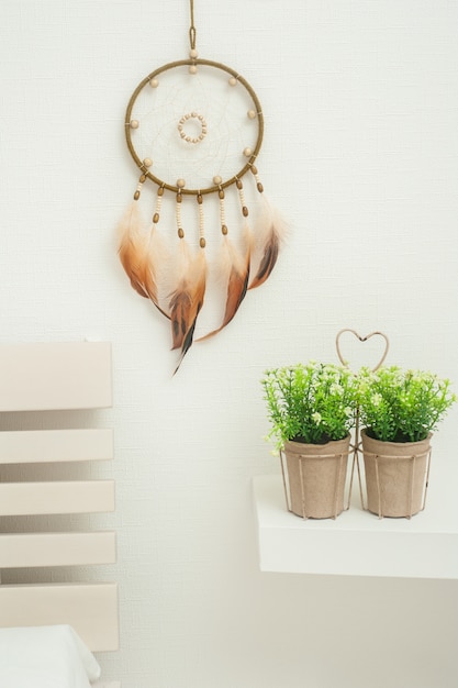 Dream catcher with orange feathers