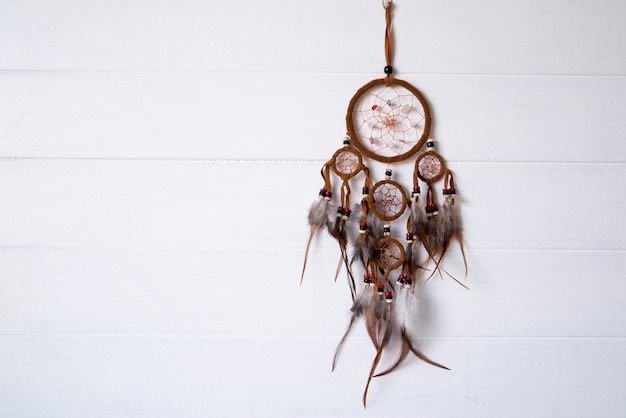 Photo dreamcatcher hanging on a white wall