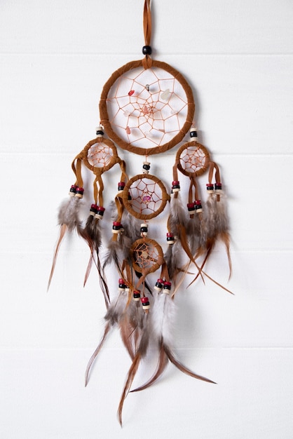 Photo dreamcatcher hanging on a white wall