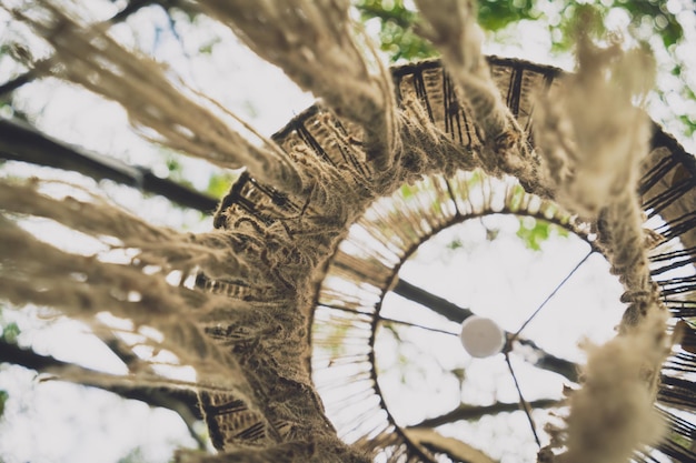 Photo dreamcatcher with feathers threads and beads rope hanging