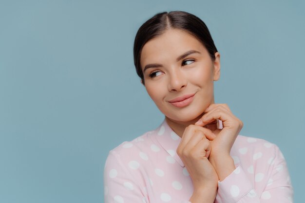 dreamy beautiful lady keeps hands together