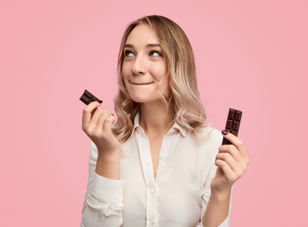 Dreamy woman with chocolate