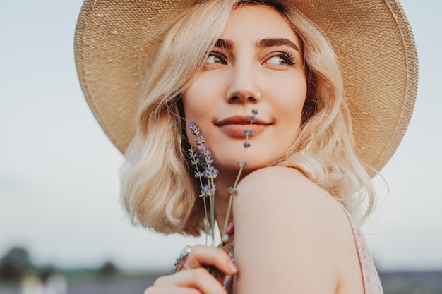 Dreamy woman with lavender flowers