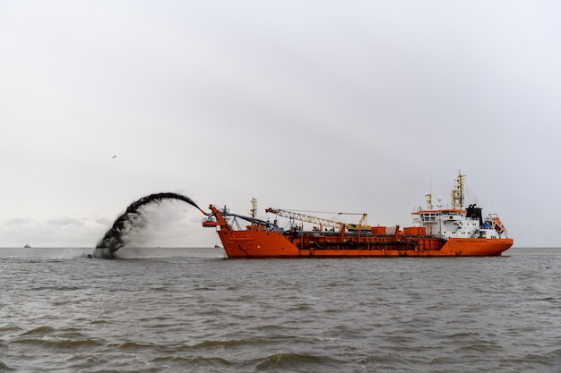 Dredger working at sea