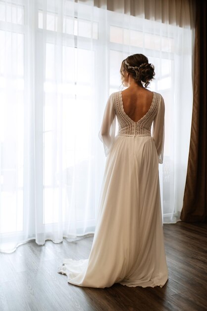 Dress up the bride in a wedding dress with corset and lacing