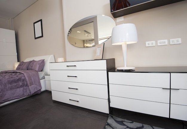 Photo dresser unit in bedroom of show home