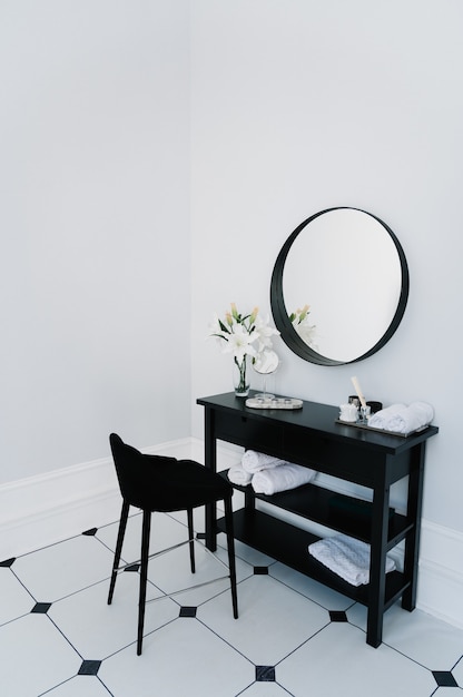 Dressing table in the bathroom with mirror and towel