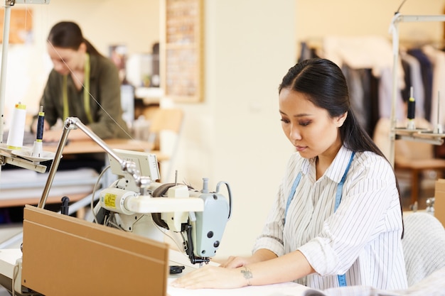 Dressmaker sewing clothes