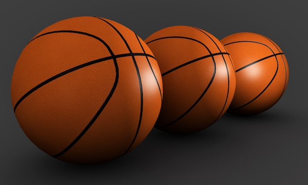 Drie basketballen op een grijze achtergrond