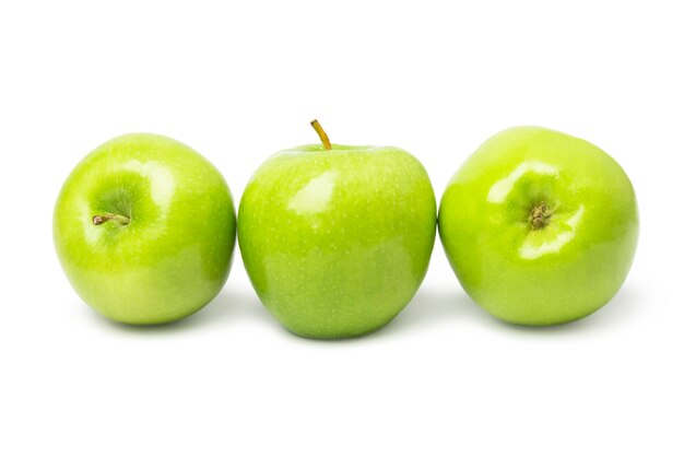 Drie groene appels op wit